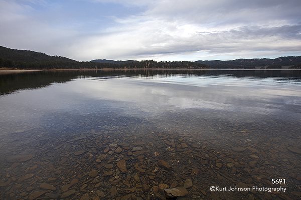 Black Hills South Dakota waterscape rocks stones water horizon sky green trees forest Dakotas
