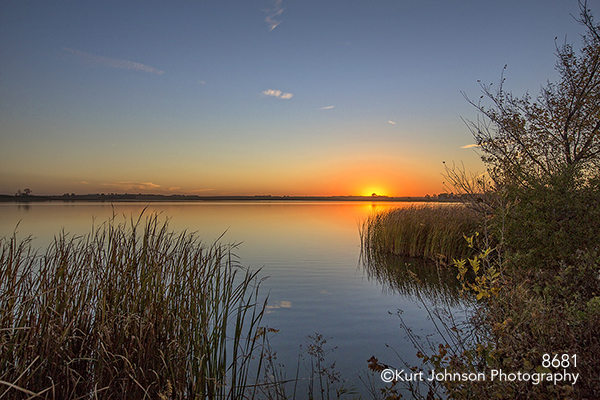 water waterscape blue orange sun sky reeds peaceful calm river