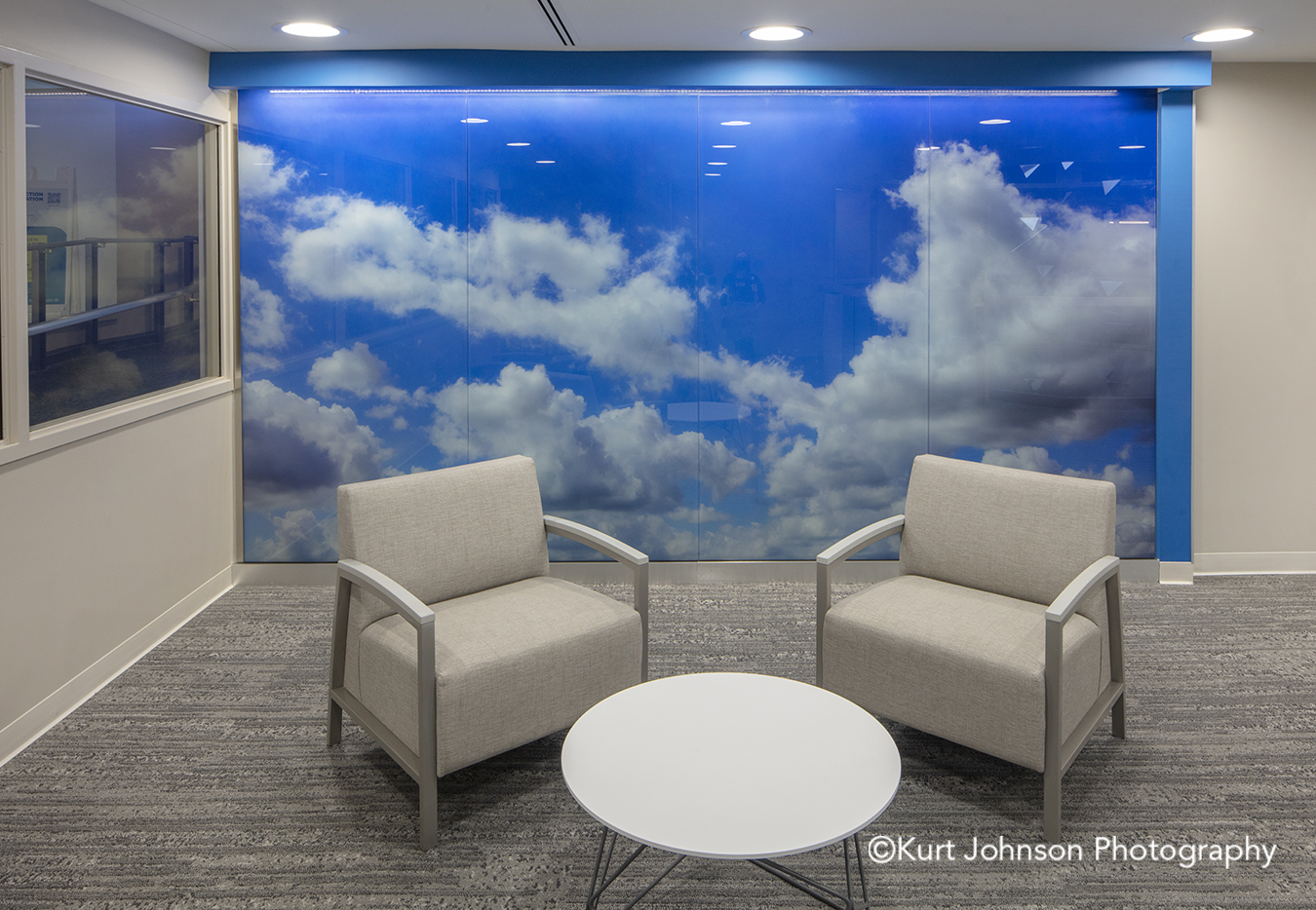 blue sky clouds landscape install glass lobby waiting installation Allina Health United Healthcare John Nasseff Medical Center atrium InVision Glass Design